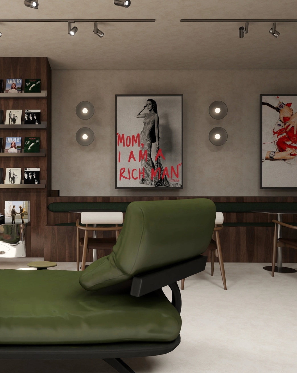 Lounge-ul Sip: un șezlong verde, raftul cu viniluri și printuri pe perete.