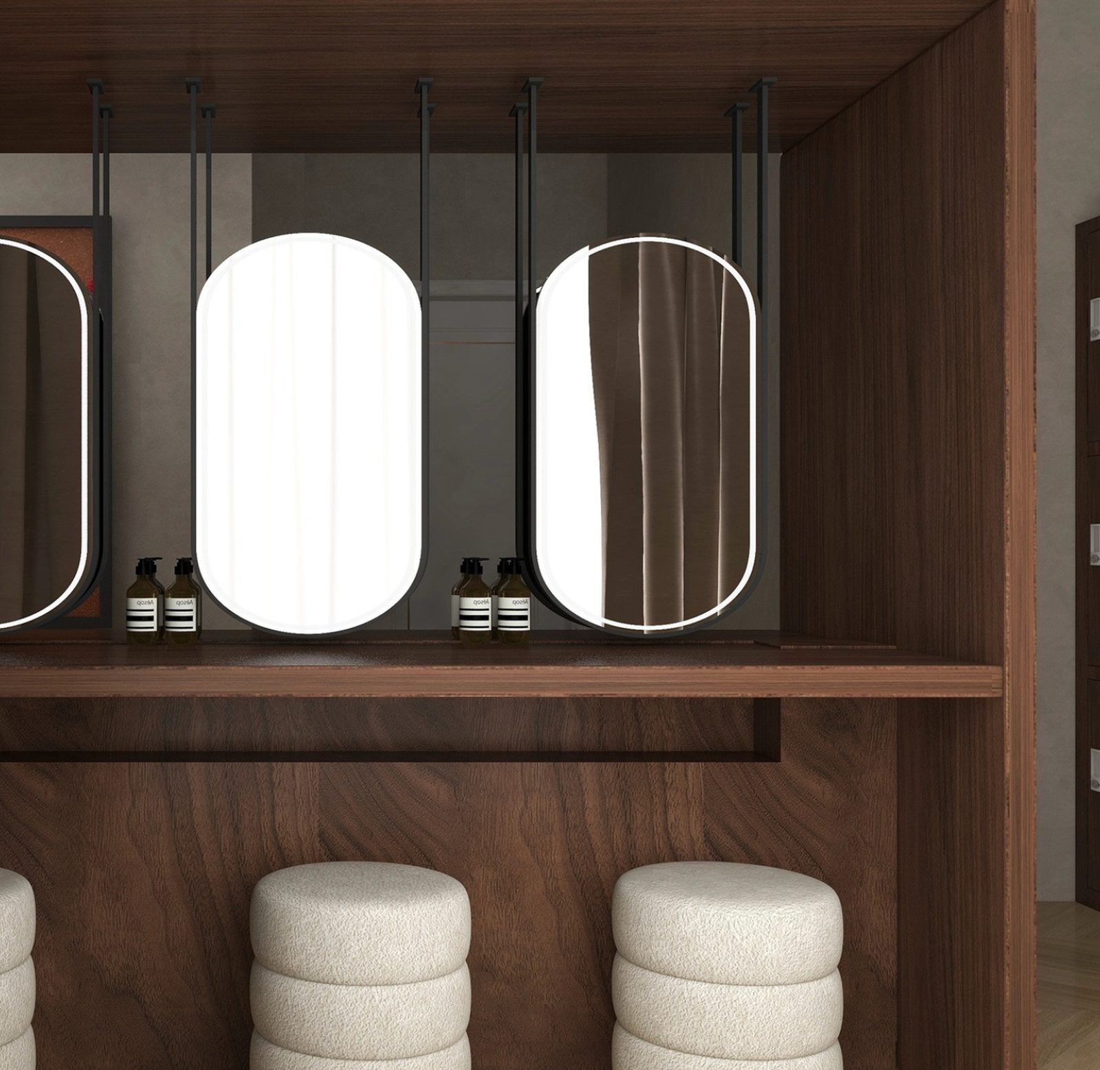 The changing room: lit mirrors, stools and the house amenities.